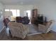 Comfortable living room featuring hardwood floors, a patterned rug, and comfortable seating at 7157 Hazeltine Cir, Lakeland, FL 33810