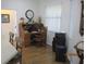 Cozy office with hardwood floors, a classic desk, and a comfortable work environment at 7157 Hazeltine Cir, Lakeland, FL 33810