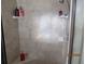 Bright, tiled shower with built-in seating and shelving at 7157 Hazeltine Cir, Lakeland, FL 33810