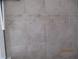 Shower stall with neutral-tone tile and decorative trim at 7157 Hazeltine Cir, Lakeland, FL 33810