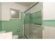This bathroom features tile walls, a glass-door shower, and modern fixtures at 727 Se 12Th St, Ocala, FL 34471