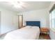 Bright bedroom showcasing hardwood floors, a window, and contemporary bedside tables at 727 Se 12Th St, Ocala, FL 34471