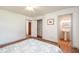 Bright bedroom featuring hardwood floors, and easy access to the bathroom and closet at 727 Se 12Th St, Ocala, FL 34471