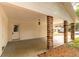 This carport features brick pillars that provide shade and architectural detail at 727 Se 12Th St, Ocala, FL 34471