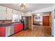This eat-in kitchen features stainless steel appliances and red and white cabinets at 727 Se 12Th St, Ocala, FL 34471