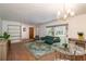 Inviting living room features a plush sofa, stylish rug, ample natural light, and an open floor plan at 727 Se 12Th St, Ocala, FL 34471