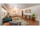 Inviting living room features a plush sofa, stylish rug, ample natural light, and an open floor plan at 727 Se 12Th St, Ocala, FL 34471