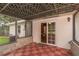 Enclosed patio with red tile flooring leads to the interior via sliding glass doors, offering seamless indoor-outdoor flow at 727 Se 12Th St, Ocala, FL 34471