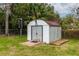 Outdoor shed offers ample storage with double doors and a brick foundation for added stability at 727 Se 12Th St, Ocala, FL 34471
