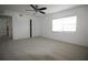 Bright bedroom with carpet flooring, a ceiling fan, and a window at 1000 S Semoran Blvd # 306, Winter Park, FL 32792
