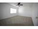 Bright bedroom with carpet flooring, a ceiling fan, and a window at 1000 S Semoran Blvd # 306, Winter Park, FL 32792