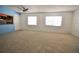 Spacious living room with neutral carpet and plenty of natural light at 1000 S Semoran Blvd # 306, Winter Park, FL 32792