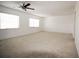 Spacious living room with neutral carpet, ceiling fan, and plenty of natural light at 1000 S Semoran Blvd # 306, Winter Park, FL 32792