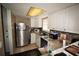 Efficient kitchen featuring white cabinets, granite countertops and stainless steel appliances at 1000 S Semoran Blvd # 404, Winter Park, FL 32792