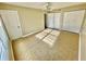 Sunlit bedroom with tile flooring, dual closets, and a modern ceiling fan at 1000 S Semoran Blvd # 408, Winter Park, FL 32792