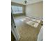 Bright bedroom with neutral walls, tile flooring, and a modern ceiling fan at 1000 S Semoran Blvd # 408, Winter Park, FL 32792