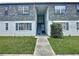Charming two-story condo with walkway, well-maintained lawn, and neutral color palette at 1000 S Semoran Blvd # 408, Winter Park, FL 32792