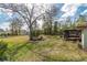 Expansive backyard featuring a screened porch and mature trees at 10441 Sw 54Th Ct, Ocala, FL 34476