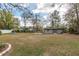 Large backyard with a shed and mature trees at 10441 Sw 54Th Ct, Ocala, FL 34476