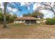 Backyard with a hot tub and screened in porch at 10441 Sw 54Th Ct, Ocala, FL 34476
