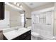 Well-lit bathroom with a large mirror, modern vanity, and a glass-enclosed shower offering a sleek design at 10441 Sw 54Th Ct, Ocala, FL 34476