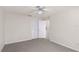 Neutral bedroom featuring carpet, ceiling fan and a closet with an adjoining doorway at 10441 Sw 54Th Ct, Ocala, FL 34476