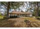 Beautiful one-story home with a landscaped front yard, white picket fence, and attached two-car garage at 10441 Sw 54Th Ct, Ocala, FL 34476