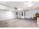 Spacious two-car garage with white walls, an automatic door, and ample space for storage or a workshop at 10441 Sw 54Th Ct, Ocala, FL 34476