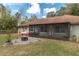 Covered porch with an outdoor seating area at 10441 Sw 54Th Ct, Ocala, FL 34476