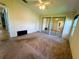 Spacious bedroom featuring sliding mirror closet doors, a ceiling fan and two windows with shades at 106 Pyracantha Ln, Leesburg, FL 34748