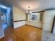 Spacious dining room featuring wood floors and bright lighting at 106 Pyracantha Ln, Leesburg, FL 34748