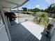 Covered front porch provides an outdoor space for relaxing and enjoying community views at 106 Pyracantha Ln, Leesburg, FL 34748