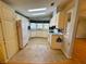 Bright kitchen featuring white appliances and plenty of storage at 106 Pyracantha Ln, Leesburg, FL 34748