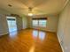 Spacious living room with ceiling fan and lots of natural light at 106 Pyracantha Ln, Leesburg, FL 34748
