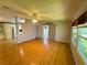Open living room with ceiling fan and access to multiple rooms at 106 Pyracantha Ln, Leesburg, FL 34748