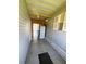 Mud room offers extra storage, a full sized refrigerator, and convenient exterior access at 106 Pyracantha Ln, Leesburg, FL 34748