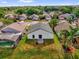 Aerial view of a single-Gathering home with a large green backyard and neighboring houses at 11172 Pinewood Cove Ln, Orlando, FL 32817