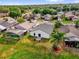 Aerial view featuring a well-maintained home with a spacious backyard and a neighborhood setting at 11172 Pinewood Cove Ln, Orlando, FL 32817