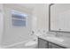 Bright bathroom featuring a tub, shower, and a modern vanity with ample storage at 11172 Pinewood Cove Ln, Orlando, FL 32817