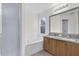 Bathroom featuring a tub, a separate glass shower and granite counters with double sinks at 11172 Pinewood Cove Ln, Orlando, FL 32817