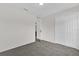 Carpeted bedroom offering a closet and entry to other spaces within the home at 11172 Pinewood Cove Ln, Orlando, FL 32817