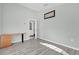 Comfortable bedroom offers sleek floors and ample space for a desk and bedroom furniture at 11172 Pinewood Cove Ln, Orlando, FL 32817
