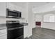 Well-equipped kitchen boasts stainless steel appliances, granite countertops, and modern cabinetry at 11172 Pinewood Cove Ln, Orlando, FL 32817