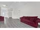 Bright living room boasts gray floors, ample space, and a welcoming atmosphere at 11172 Pinewood Cove Ln, Orlando, FL 32817