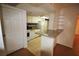 White cabinets and appliances in kitchen with open bar-counter looking into living area at 125 Water Front Way # 200, Altamonte Springs, FL 32701