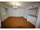 Spacious living area featuring wood floors, a chandelier, and an open bar counter at 125 Water Front Way # 200, Altamonte Springs, FL 32701