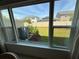 View of the backyard from inside the home showcases the lawn and privacy fence at 1258 Wispy Cypress Drive Dr, Kissimmee, FL 34746