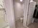 Bright bathroom with a modern tiled shower and adjacent toilet room and closet at 1258 Wispy Cypress Drive Dr, Kissimmee, FL 34746