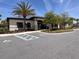 Community clubhouse showcasing accessible parking, landscaping, and a welcoming entrance at 1258 Wispy Cypress Drive Dr, Kissimmee, FL 34746