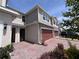 Exterior view of home featuring a brick paver driveway at 1258 Wispy Cypress Drive Dr, Kissimmee, FL 34746